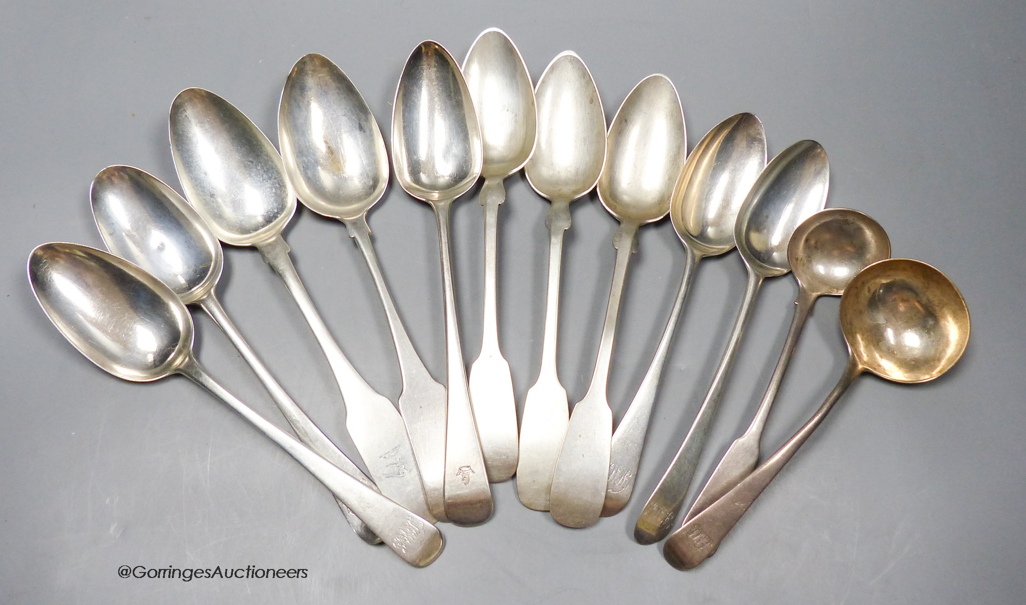 Seven assorted 18th and 19th century silver table spoons, and two sauce ladles, various patterns, dates and makers, 16oz and three continental white metal table spoons, 4.5oz.